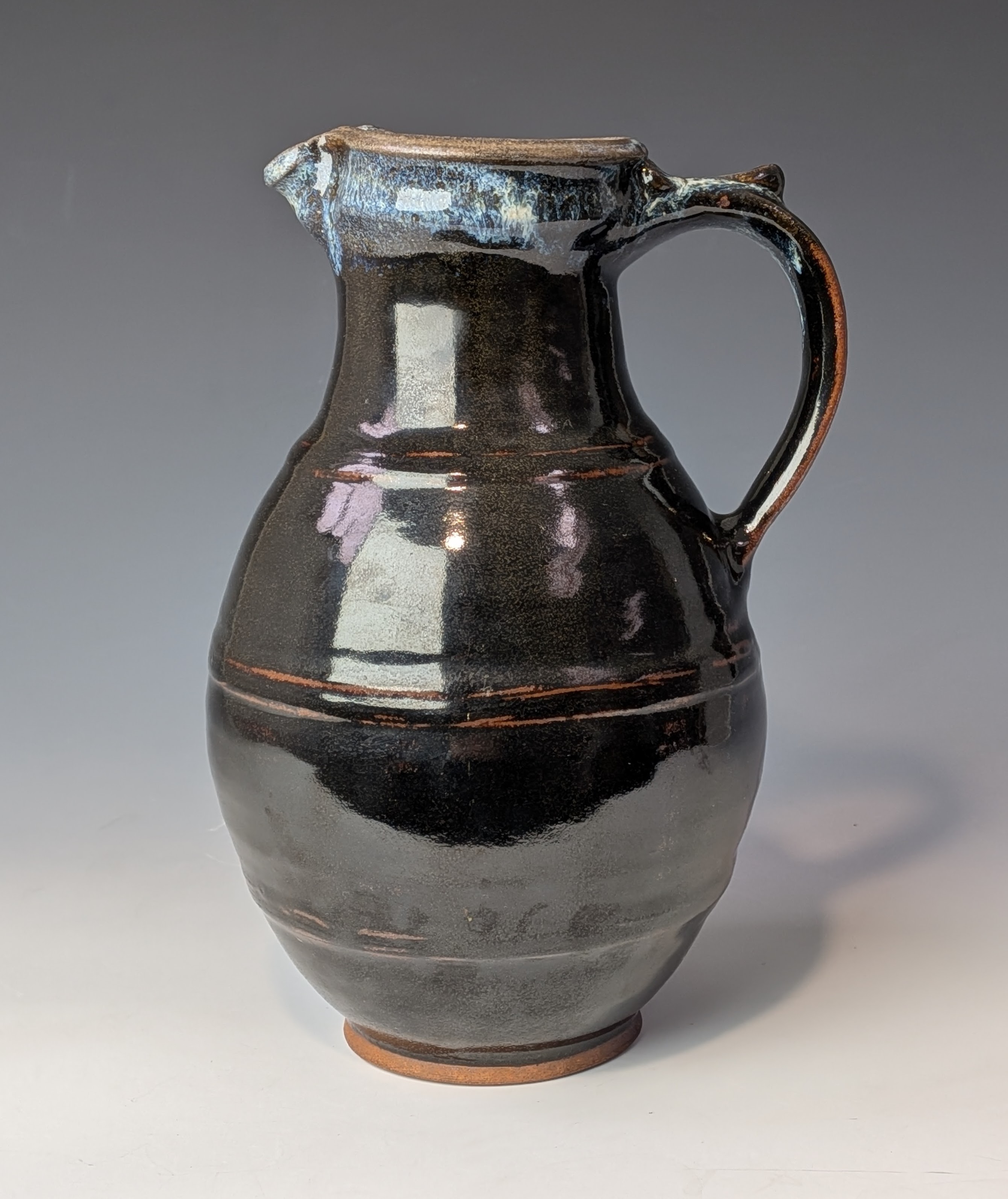 tenmoku glazed jug with chun rim
